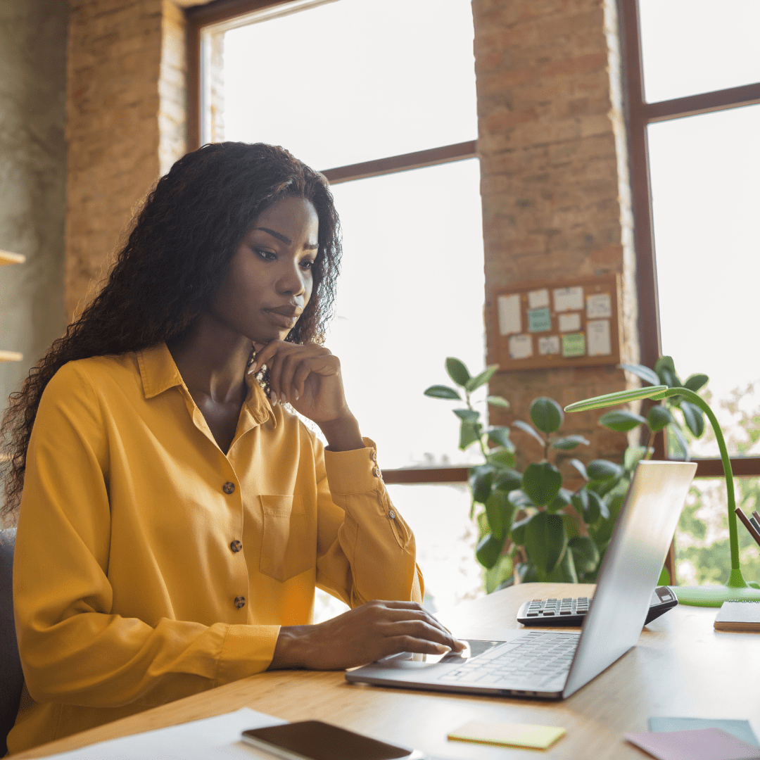 Black woman deciding between online vs in person therapy