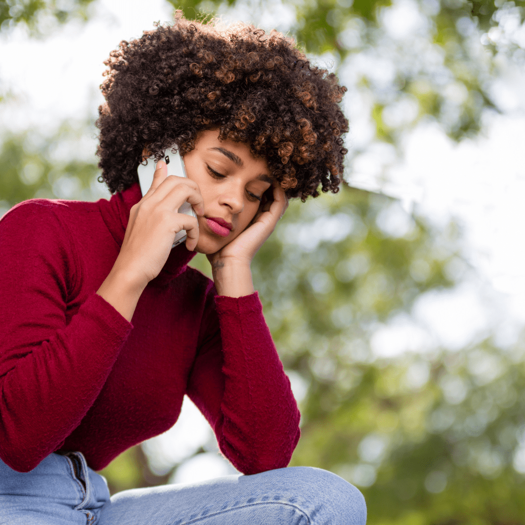 Black woman frustrated and unsure of the signs of a toxic relationship