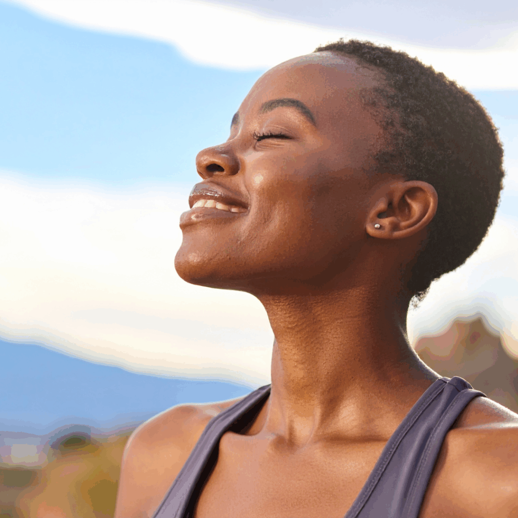 Black woman smiling outdoors | How to process emotions
