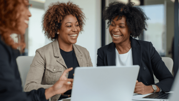 Black women friends laughing at work | How to make friends as an adult